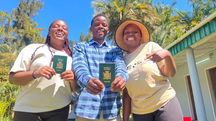 Church members from different nations holding up their passports